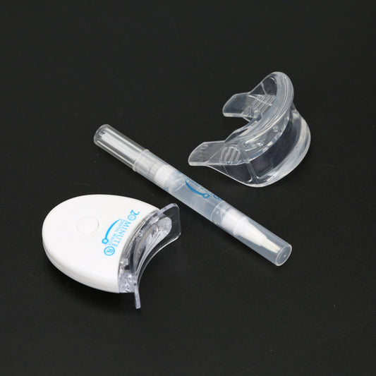 Teeth Whitening Kit components including a whitening pen and mouth trays for at-home teeth whitening.
