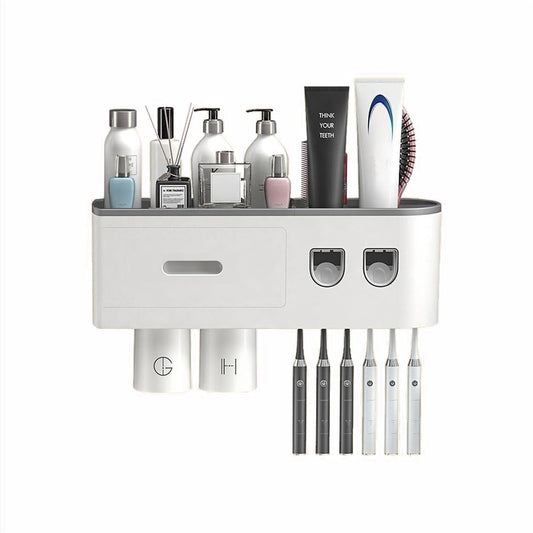 Automatic toothpaste dispenser with cups and bathroom organizer for toothbrushes and toiletries.
