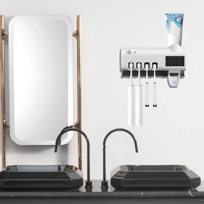 UV Light Sterilizer Toothbrush Holder Cleaner & Automatic Toothpaste Dispenser mounted above a stylish bathroom sink.