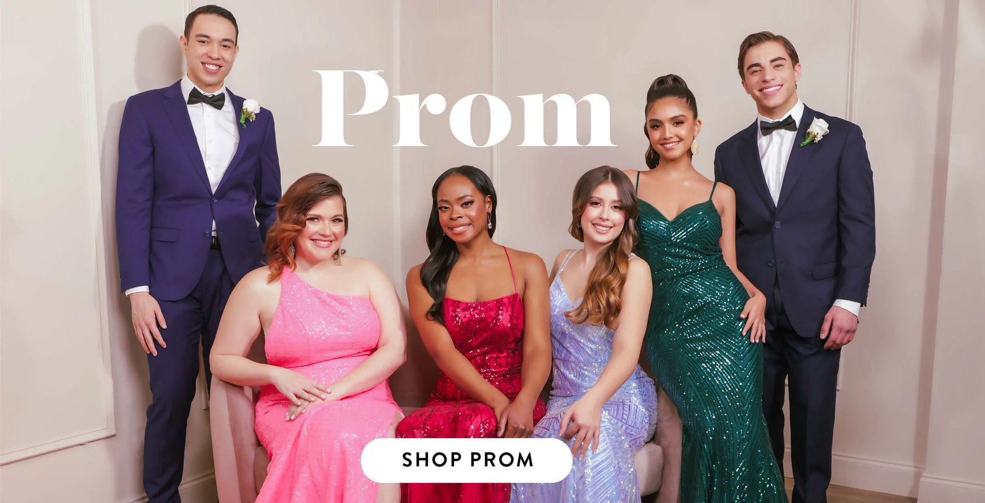Group of friends posing in formal attire for prom, showcasing elegant dresses and suits with a 'Shop Prom' call to action.
