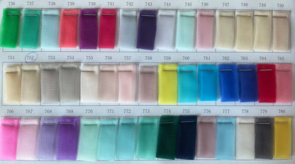 Color swatches of various fabrics including tulle for asymmetrical prom gown designs in multiple shades.