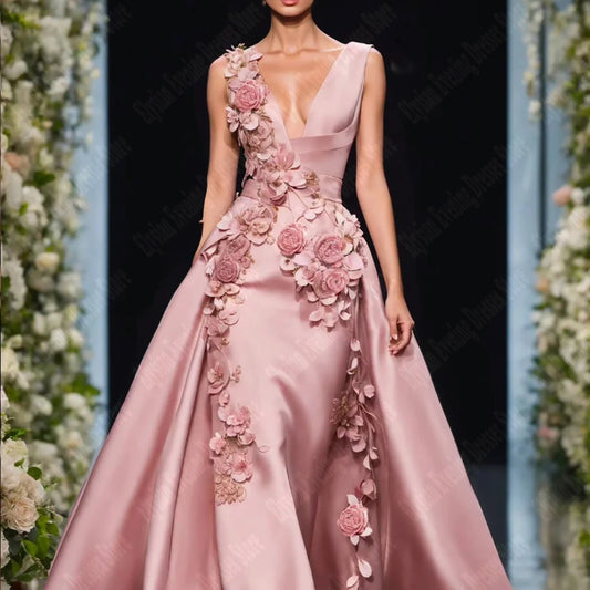 Elegant evening dresses with 3D flowers on a model wearing a sleeveless satin gown with a V-neck and floral embellishments.