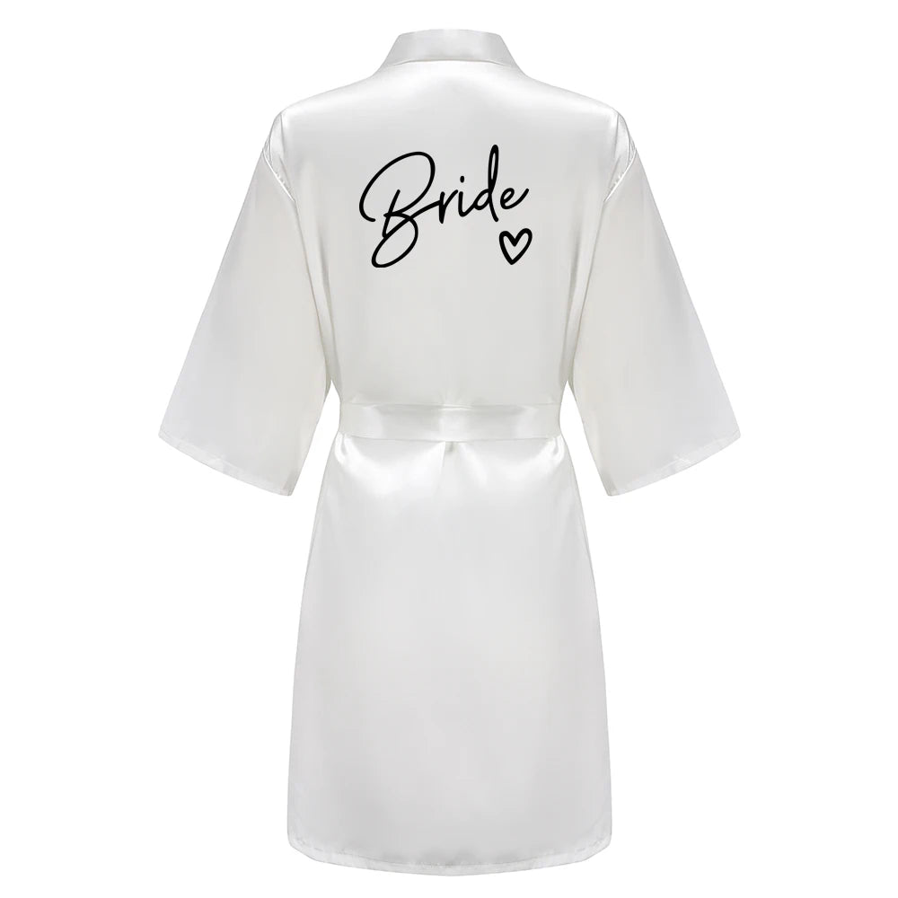 Bridesmaid satin robes featuring a white kimono with 'Bride' printed in elegant black letters on the back.