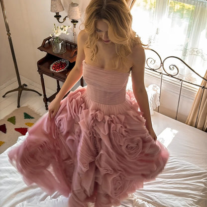 Amanda Customized light pink strapless prom dress with 3D rose ruffles and sheer fabric showcased indoors.