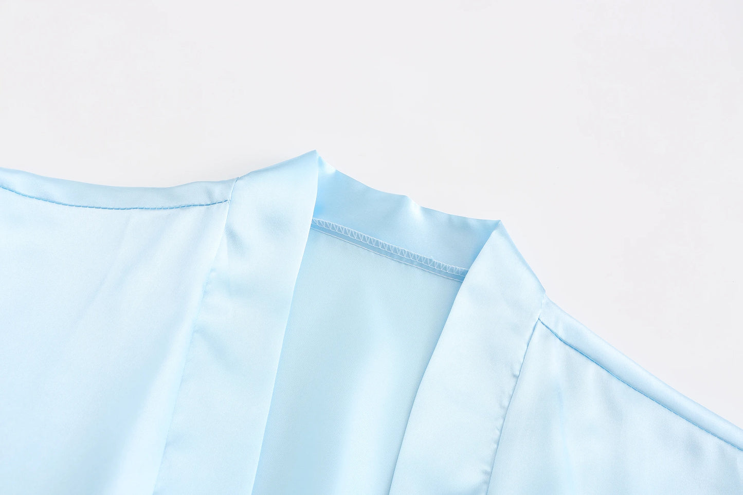 Light blue women's satin robe fabric close-up for wedding party satin robe, perfect for brides and bridesmaids.