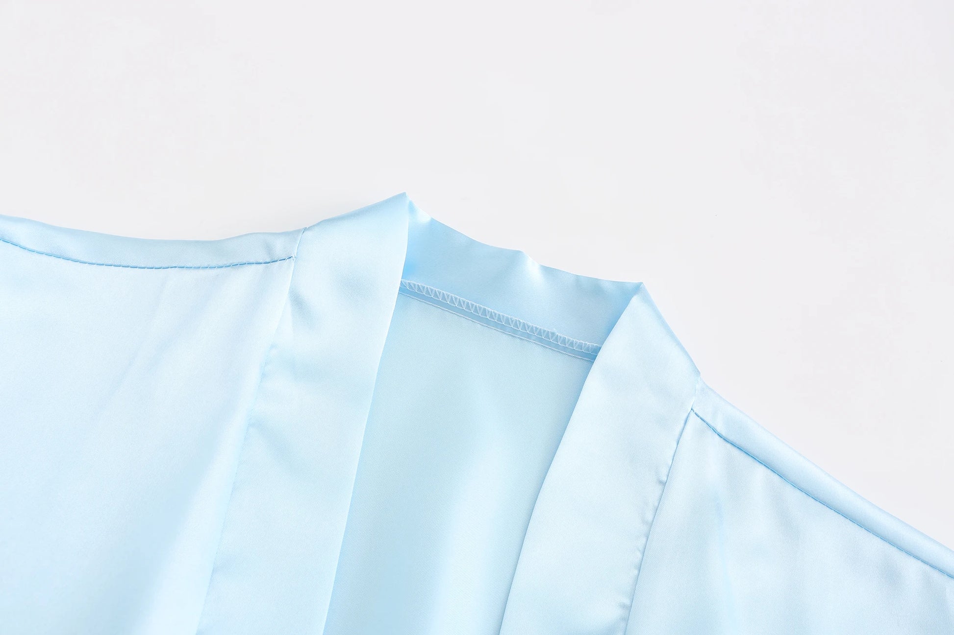 Light blue women's satin robe fabric close-up for wedding party satin robe, perfect for brides and bridesmaids.
