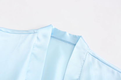 Light blue women's satin robe fabric close-up for wedding party satin robe, perfect for brides and bridesmaids.
