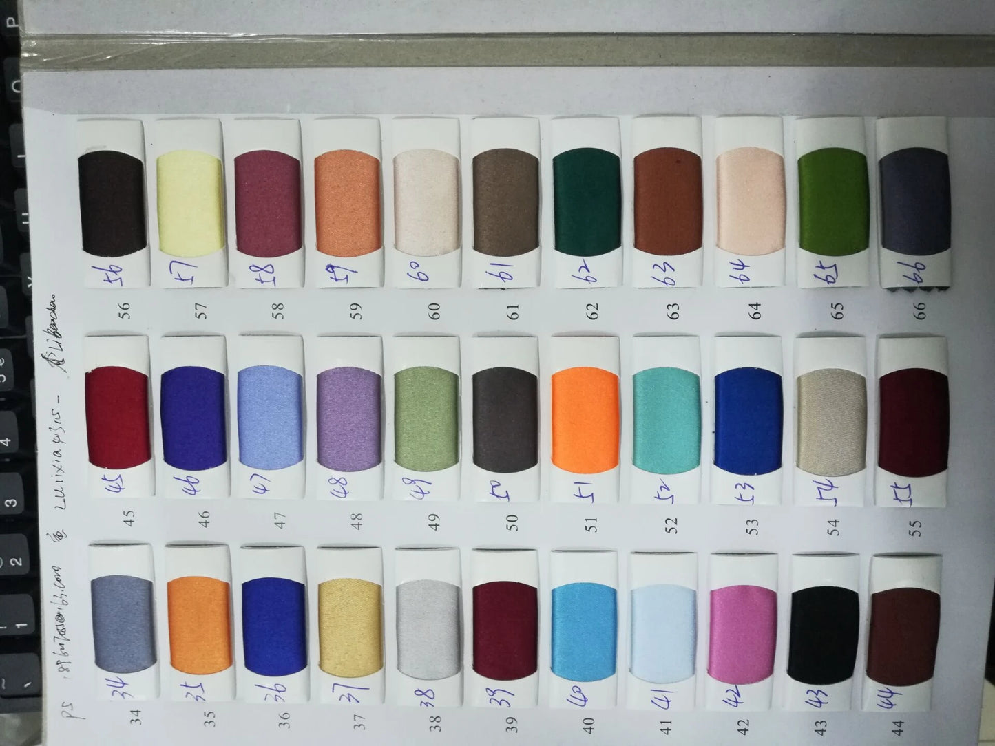 Color swatches for fabric selection showcasing various shades for mermaid evening dresses.