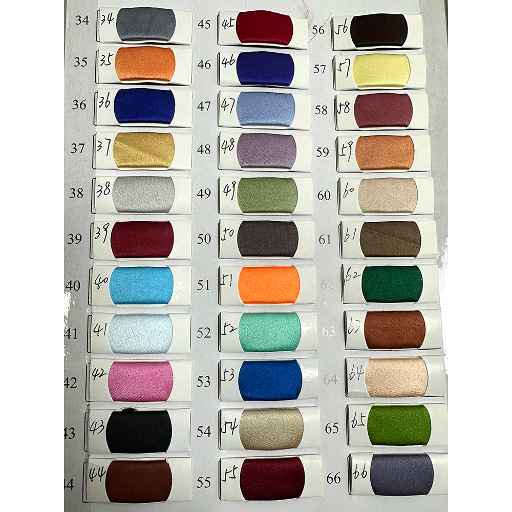 Color swatch chart showcasing various fabric hues for custom evening dress options.