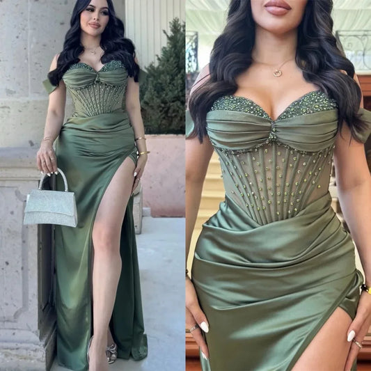 Green satin mermaid prom dress with sweetheart neckline and high side slit, embellished with sequins and beading.