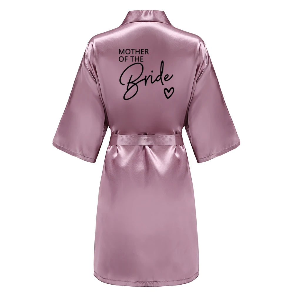Back view of a satin robe with 'MOTHER OF THE BRIDE' in elegant black letters, perfect for wedding events.