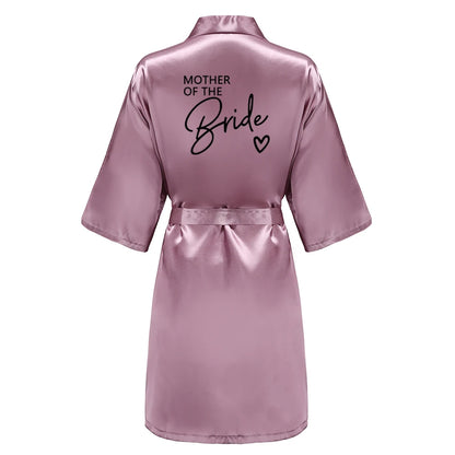 Back view of a satin robe with 'MOTHER OF THE BRIDE' in elegant black letters, perfect for wedding events.