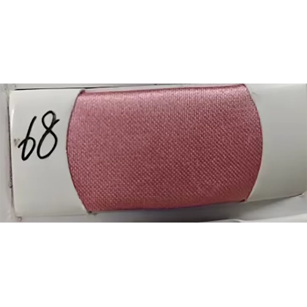 A spool of pink fabric numbered 68, showcasing a soft texture and vibrant color, perfect for craft projects.
