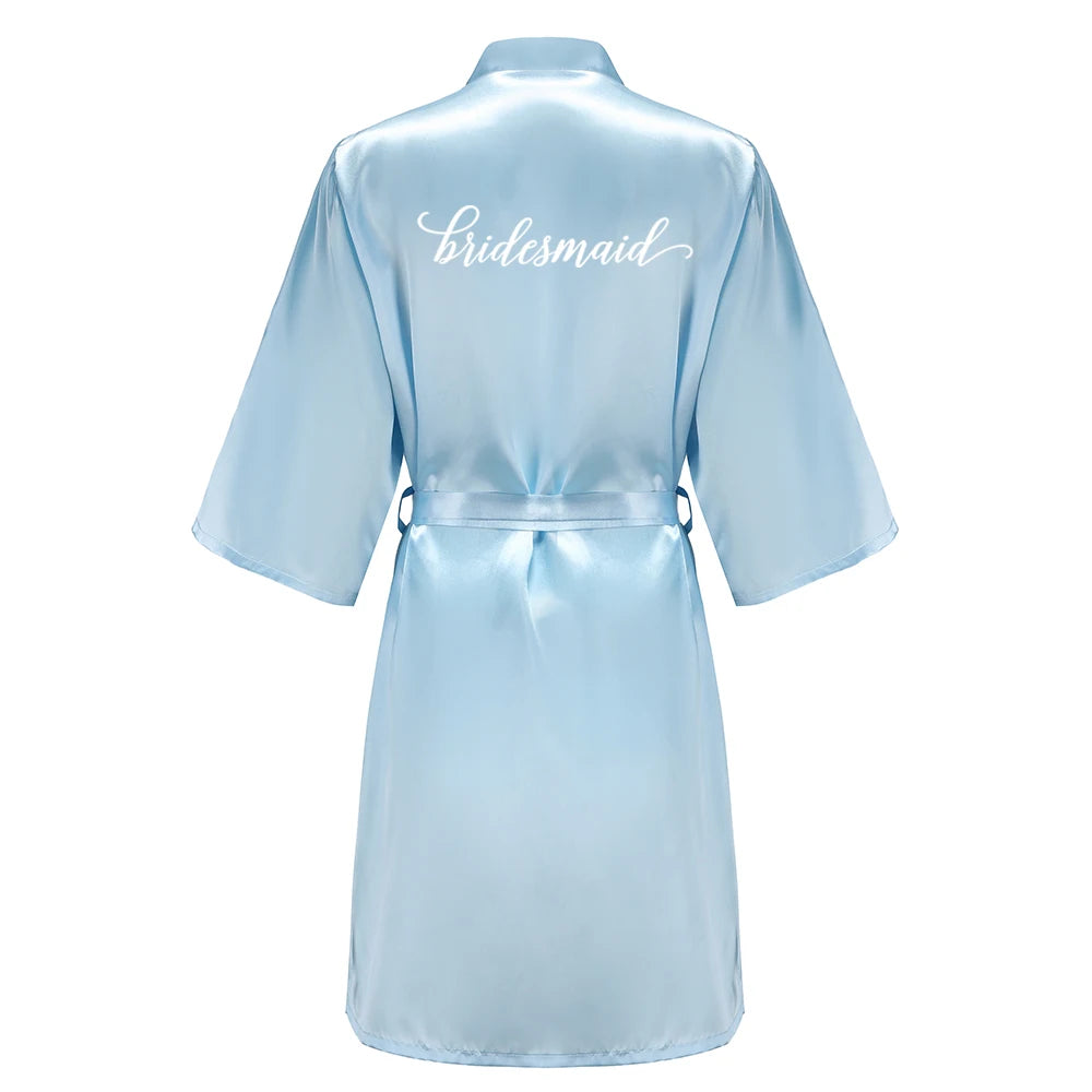 Light blue women's satin robe for bridesmaid, featuring elegant white lettering, perfect for wedding party satin robe.