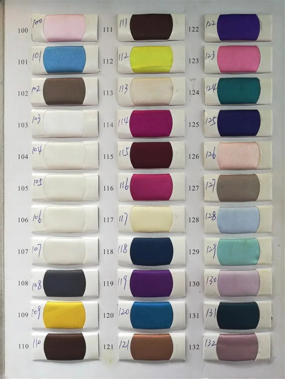 Color swatches for satin fabrics, showcasing a variety of shades numbered from 100 to 132.