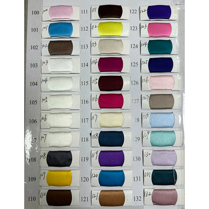 Color swatch chart with various fabric samples for evening dresses showcasing diverse shades and textures.